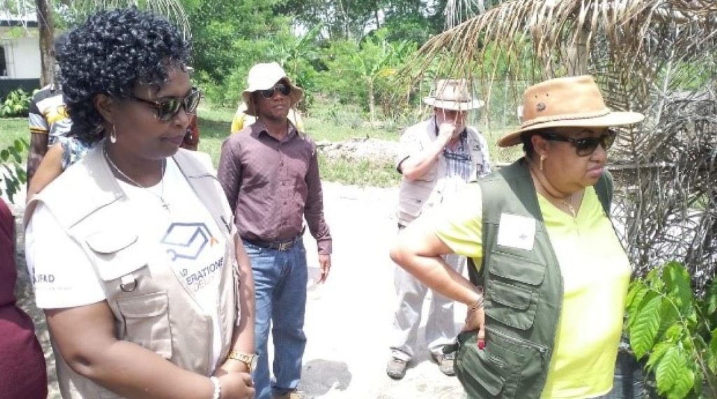 (R-l) Agriculture Minister, Jeanine M. Cooper, IFAD Country Director, Pascaline Barankeba inspect the cocoa seed garden.